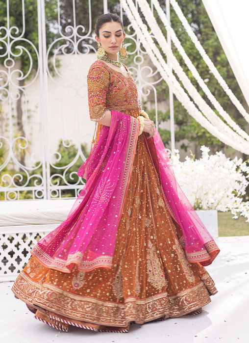 Photo of burnt orange sabyasachi lehenga with floral dupatta | Best indian  wedding dresses, Indian wedding planning, Stylish wedding
